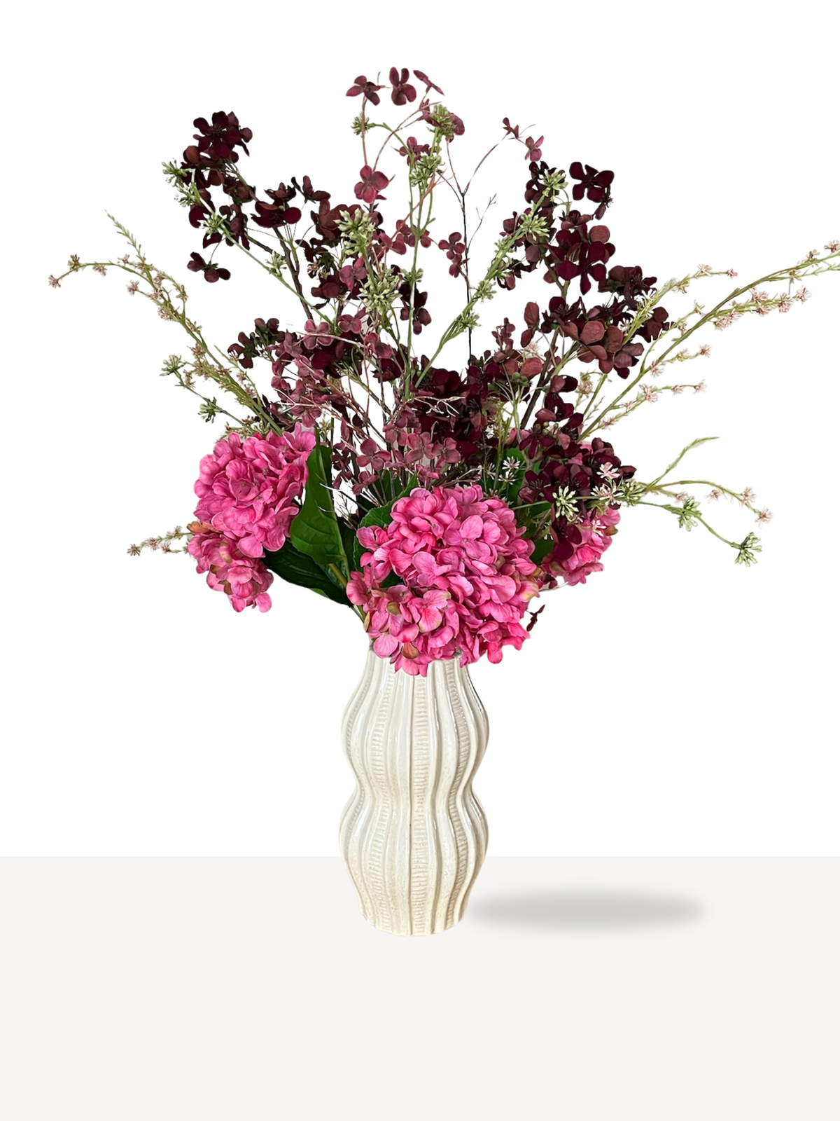 zijden boeket in diep paarse kleur met fuchsia accenten 
